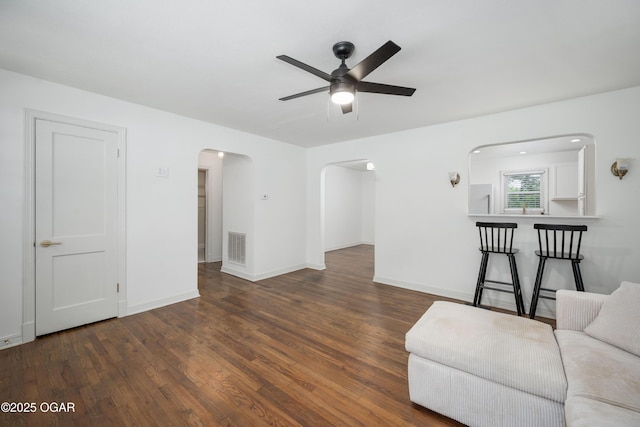 424 S Mcconnell Ave, Joplin, MO 64801 - living area featuring arched walkways, a ceiling fan, and wood finished floors