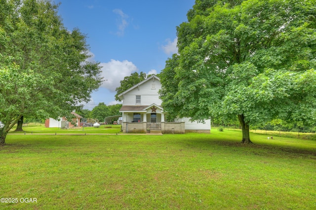 7614 Apple, Sarcoxie, MO 64862 - view of grassy yard featuring a detached carport and a wooden deck