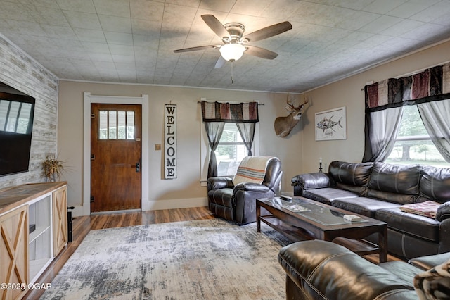 7614 Apple, Sarcoxie, MO 64862 - living area featuring healthy amount of natural light, ceiling fan, wood finished floors, and crown molding