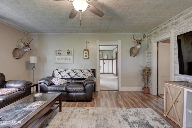7614 Apple, Sarcoxie, MO 64862 - living room with wood finished floors, crown molding, and a ceiling fan