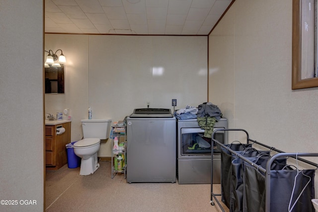 7614 Apple, Sarcoxie, MO 64862 - bathroom featuring washing machine and dryer, vanity, and crown molding