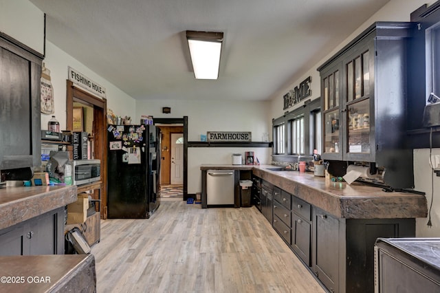 7614 Apple, Sarcoxie, MO 64862 - kitchen featuring appliances with stainless steel finishes, light wood finished floors, and dark countertops