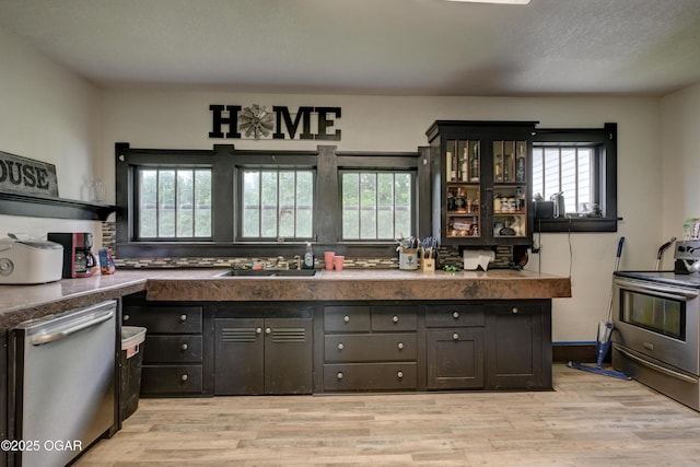 7614 Apple, Sarcoxie, MO 64862 - kitchen with stainless steel appliances, dark countertops, and light wood-type flooring