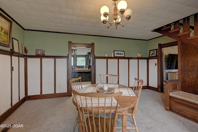 7614 Apple, Sarcoxie, MO 64862 - dining area with light colored carpet, a chandelier, and crown molding
