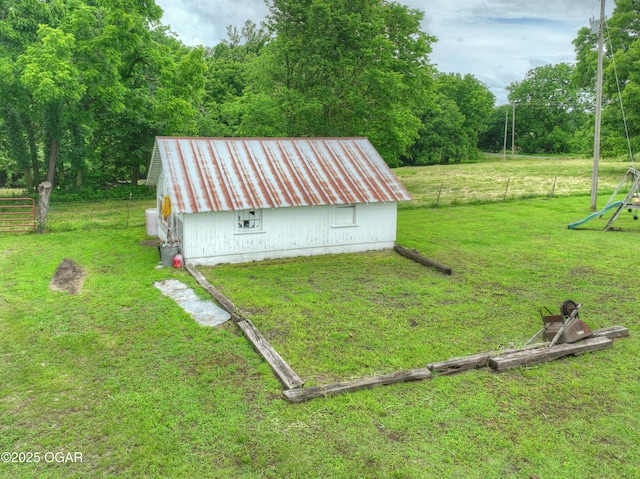 7614 Apple, Sarcoxie, MO 64862 - view of yard featuring an outbuilding and a wooded view
