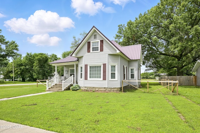 301 N 1st St, Jasper, MO 64755 - view of front of home with a metal roof and a porch