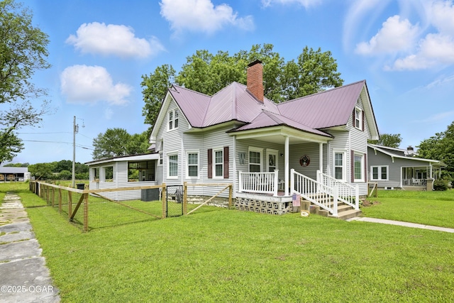 301 N 1st St, Jasper, MO 64755 - view of front facade featuring a chimney and a metal roof