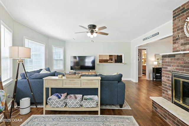 301 N 1st St, Jasper, MO 64755 - living area with a fireplace, ornamental molding, wood finished floors, and ceiling fan