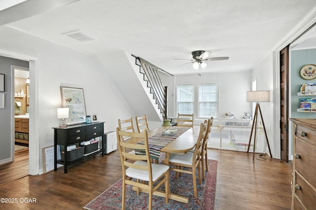 301 N 1st St, Jasper, MO 64755 - dining area with ceiling fan, dark wood finished floors, and stairway
