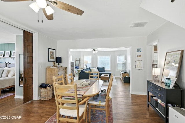 301 N 1st St, Jasper, MO 64755 - dining area featuring a ceiling fan, dark wood-style flooring, and crown molding