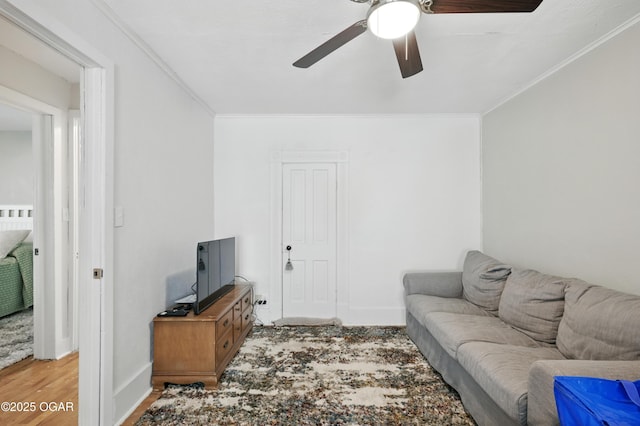 301 N 1st St, Jasper, MO 64755 - living room with a ceiling fan, crown molding, and light wood-style floors