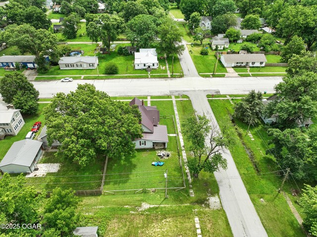 301 N 1st St, Jasper, MO 64755 - aerial view of residential area featuring a tree filled landscape