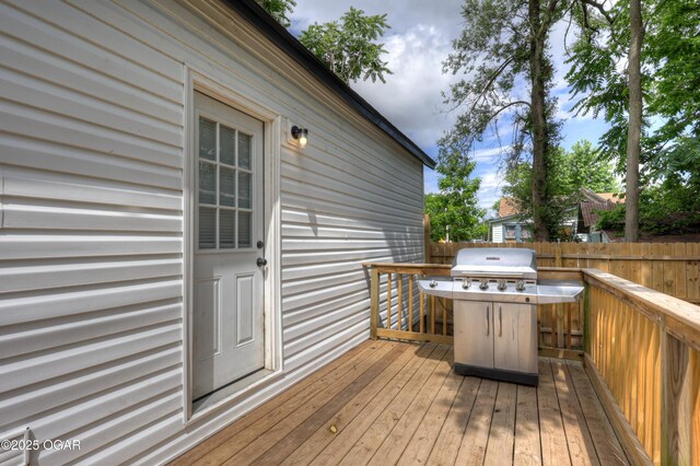 421 W 6th St, Baxter Springs, KS 66713 - wooden deck featuring a grill