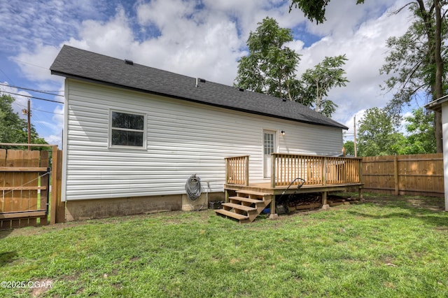 421 W 6th St, Baxter Springs, KS 66713 - rear view of property with a deck, a fenced backyard, and a shingled roof