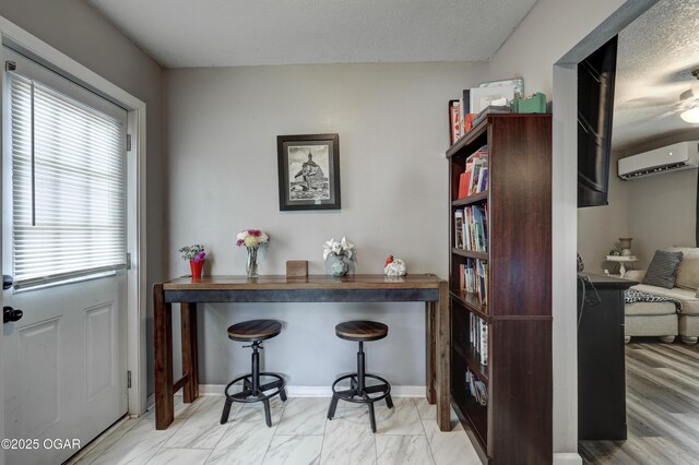 421 W 6th St, Baxter Springs, KS 66713 - bar with a wall mounted AC, a textured ceiling, and marble finish flooring