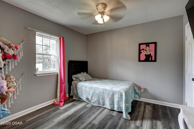 421 W 6th St, Baxter Springs, KS 66713 - bedroom featuring wood finished floors, a textured ceiling, and ceiling fan