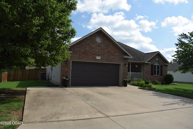 1902 E Natalie Ln, Joplin, MO 64801 - view of front of house with an attached garage, brick siding, and concrete driveway