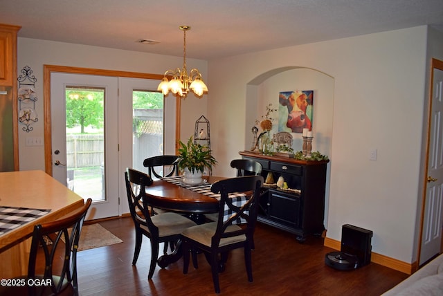 1902 E Natalie Ln, Joplin, MO 64801 - dining space featuring dark wood-style floors and a chandelier