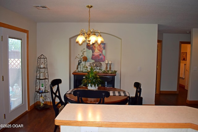 1902 E Natalie Ln, Joplin, MO 64801 - dining space with a chandelier and dark wood-type flooring