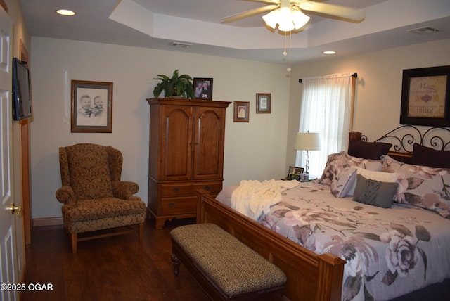 1902 E Natalie Ln, Joplin, MO 64801 - bedroom featuring dark wood-style floors, recessed lighting, a ceiling fan, and a raised ceiling