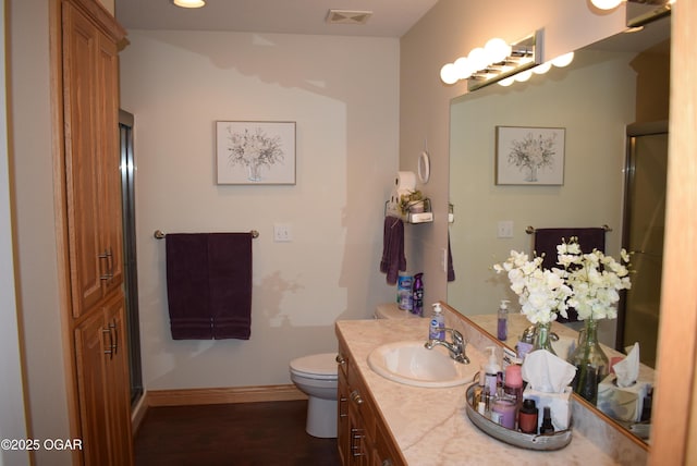 1902 E Natalie Ln, Joplin, MO 64801 - full bath featuring vanity, wood finished floors, and a shower with shower door