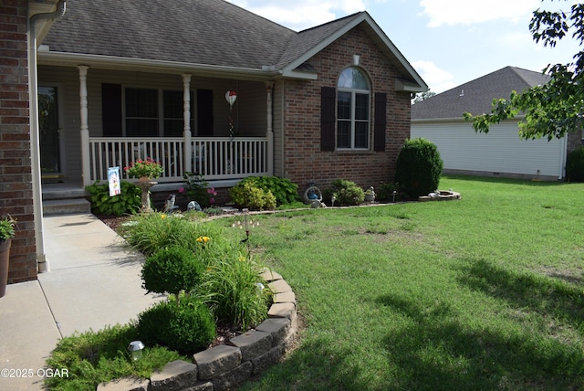 1902 E Natalie Ln, Joplin, MO 64801 - view of front facade featuring a porch, brick siding, a front lawn, and a shingled roof