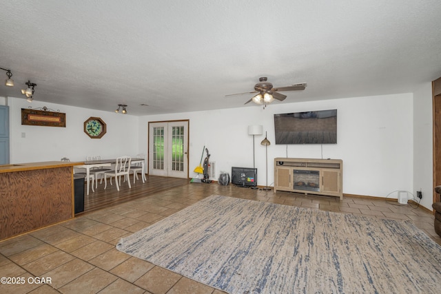 645 Worth St, Granby, MO 64844 - tiled living room with a ceiling fan and a textured ceiling