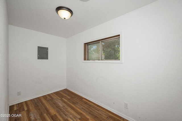 645 Worth St, Granby, MO 64844 - unfurnished room with electric panel and dark wood-style flooring