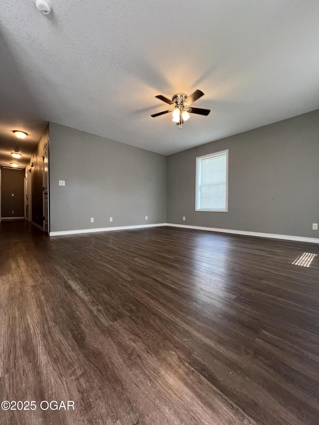 2124 S Byers Ave, Joplin, MO 64804 - unfurnished room featuring ceiling fan and dark wood-type flooring