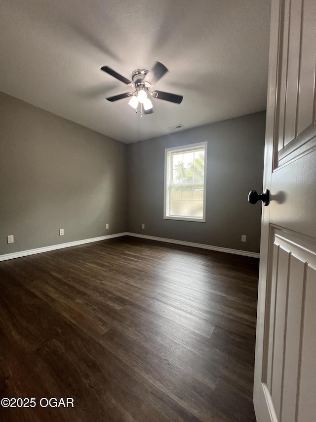 2124 S Byers Ave, Joplin, MO 64804 - unfurnished room with dark wood finished floors and a ceiling fan