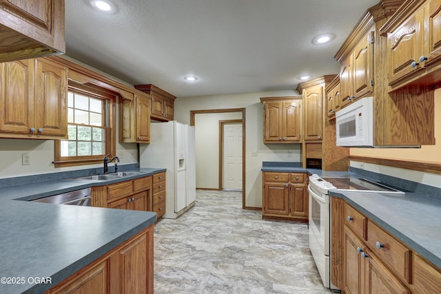 6181 County Lane 306, Carl Junction, MO 64834 - kitchen featuring white appliances, dark countertops, brown cabinetry, and recessed lighting