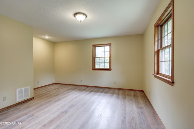 6181 County Lane 306, Carl Junction, MO 64834 - spare room featuring wood finished floors and baseboards