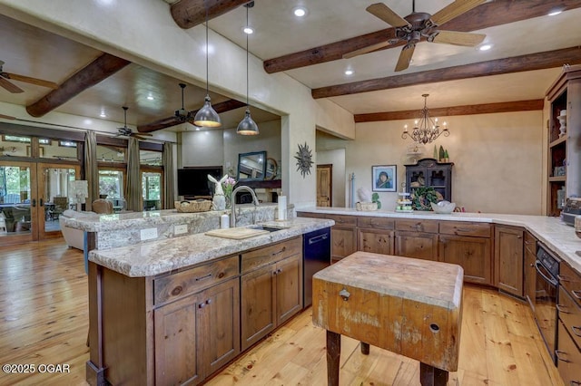 10640 Durango Ln, Carthage, MO 64836 - kitchen with ceiling fan, beamed ceiling, black appliances, open floor plan, and light wood-style floors