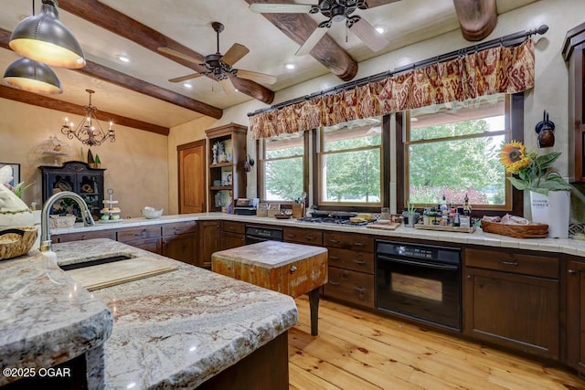10640 Durango Ln, Carthage, MO 64836 - kitchen featuring oven, light wood-style flooring, beam ceiling, light countertops, and a ceiling fan