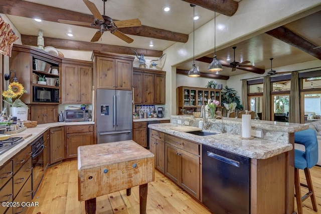 10640 Durango Ln, Carthage, MO 64836 - kitchen featuring black appliances, a ceiling fan, light wood finished floors, beam ceiling, and decorative backsplash