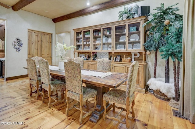10640 Durango Ln, Carthage, MO 64836 - dining area with beamed ceiling and light wood finished floors