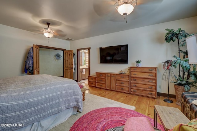 10640 Durango Ln, Carthage, MO 64836 - bedroom featuring wood finished floors, ceiling fan, and ensuite bath