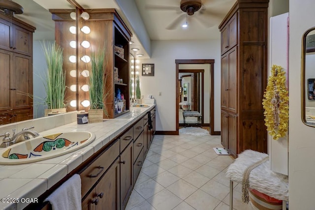 10640 Durango Ln, Carthage, MO 64836 - full bath with double vanity, tile patterned floors, and ceiling fan