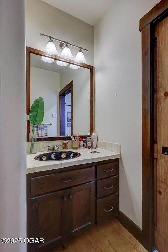 10640 Durango Ln, Carthage, MO 64836 - bathroom featuring vanity and wood finished floors