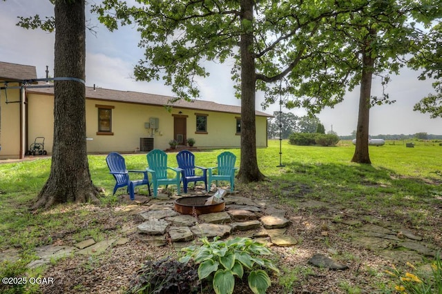 10640 Durango Ln, Carthage, MO 64836 - view of grassy yard featuring an outdoor fire pit