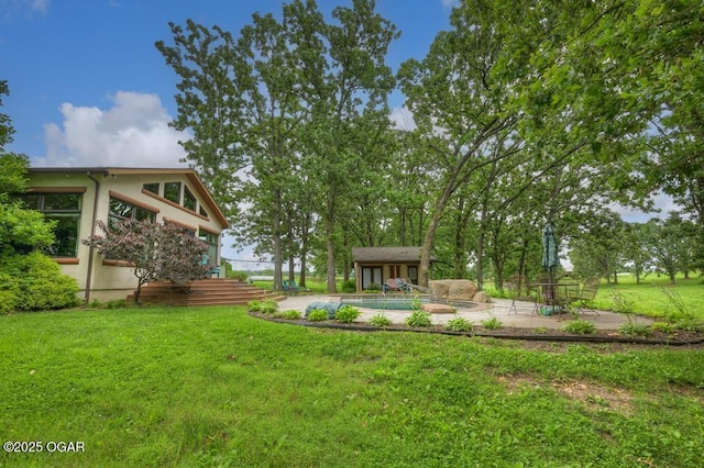 10640 Durango Ln, Carthage, MO 64836 - view of grassy yard featuring a patio