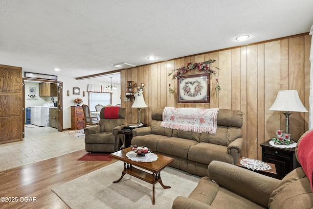 2015 W Zora St, Joplin, MO 64801 - living area with wooden walls, a textured ceiling, wood finished floors, and recessed lighting