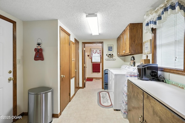 2015 W Zora St, Joplin, MO 64801 - laundry area featuring cabinet space, washing machine and dryer, and a textured ceiling