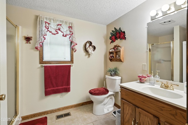 2015 W Zora St, Joplin, MO 64801 - full bathroom with a textured ceiling, a stall shower, vanity, and tile patterned floors