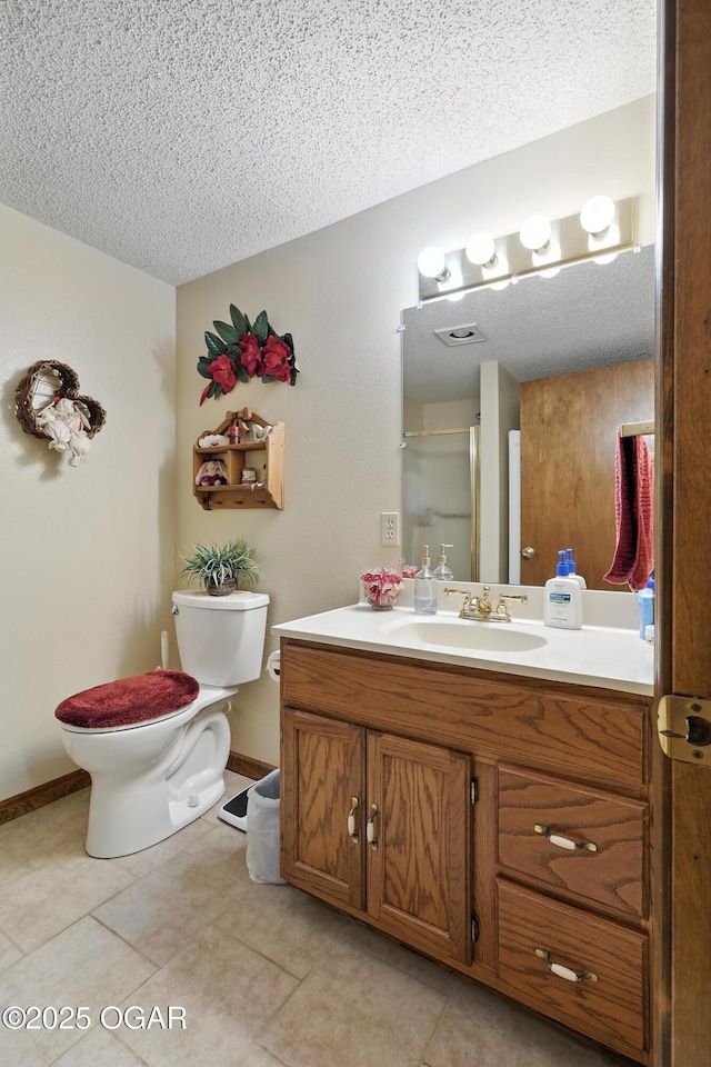 2015 W Zora St, Joplin, MO 64801 - bathroom featuring a textured ceiling, vanity, tile patterned flooring, and a shower with shower door