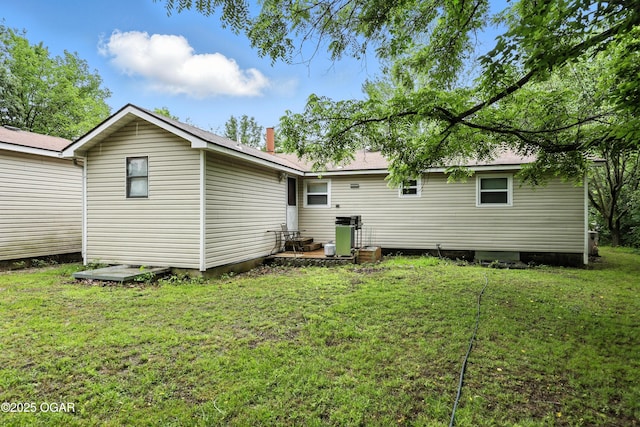 2015 W Zora St, Joplin, MO 64801 - rear view of property with a lawn and a patio area