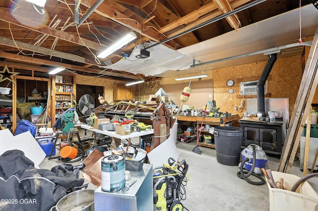 2015 W Zora St, Joplin, MO 64801 - garage featuring a garage door opener, a workshop area, and a wall mounted AC
