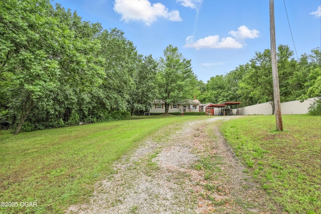2015 W Zora St, Joplin, MO 64801 - view of front of property with driveway, a carport, and a front lawn