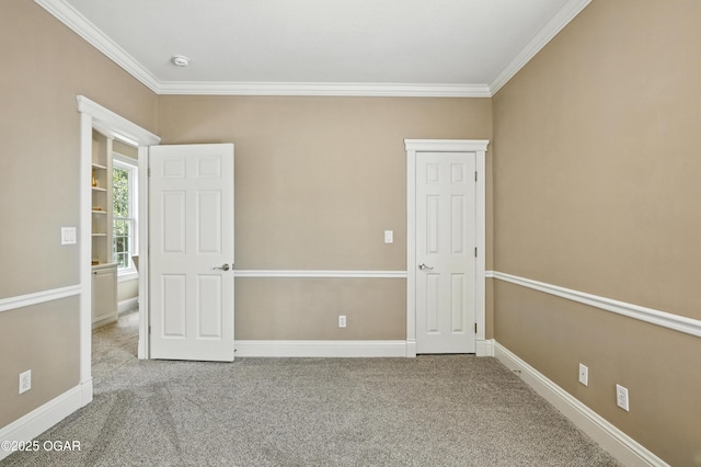 509 W Highland Ave, Carthage, MO 64836 - unfurnished bedroom with ornamental molding and carpet flooring