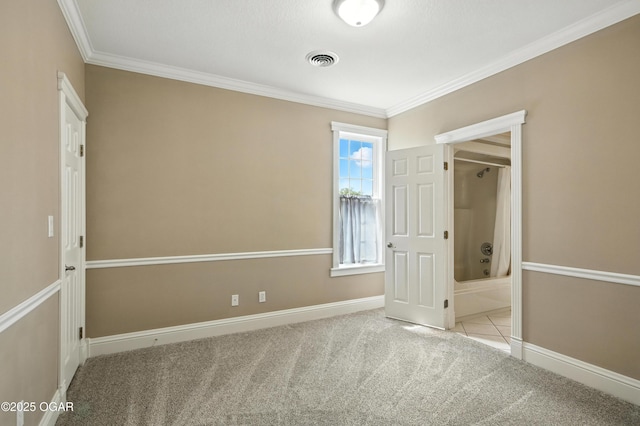 509 W Highland Ave, Carthage, MO 64836 - unfurnished bedroom featuring carpet floors, ornamental molding, and connected bathroom